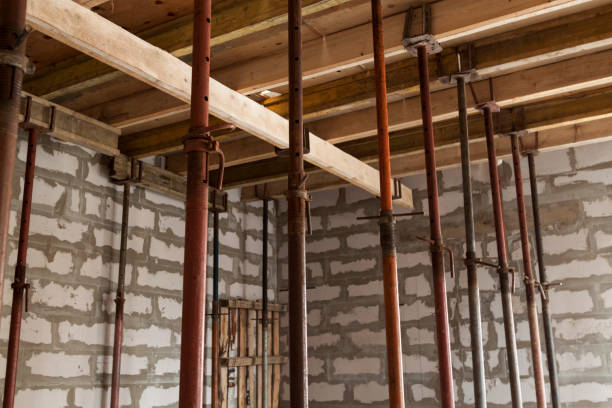 istock view of wooden formwork with metallic holders, which will be filled with overlap between floors in country house under construction from foam block 1291652635