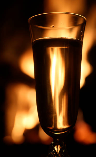 istock champagne glass with fire background as celebration event 1291652966