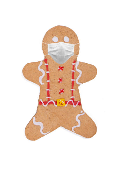 istock Gingerbread Cookie With Medical Mask 1291653840