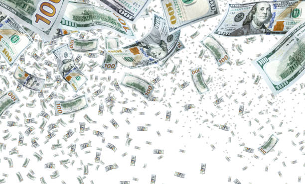 Conceptual falling large group of money over white