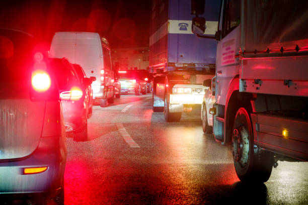 istock Traffic jam at night on the wet highway 1291654571