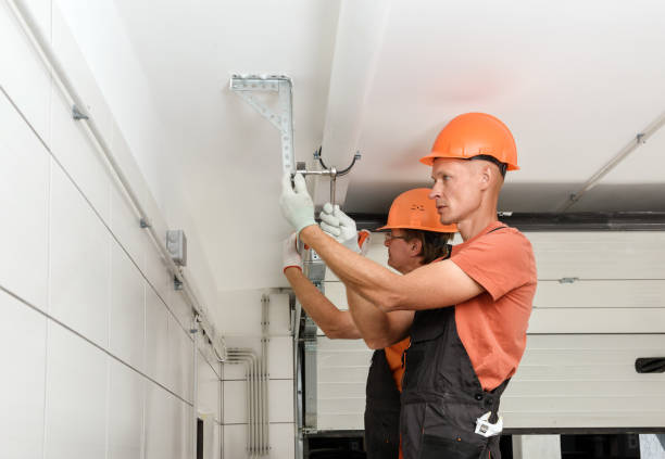 istock The workers are installing lift gates in the garage. 1291655219