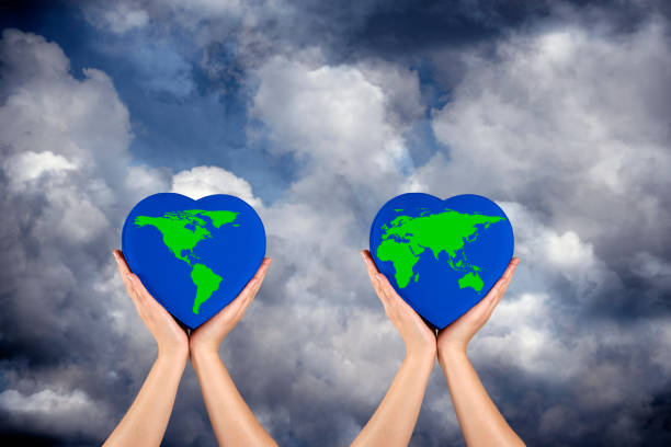 istock Conceptual environmental image of hands holding world 1291655457