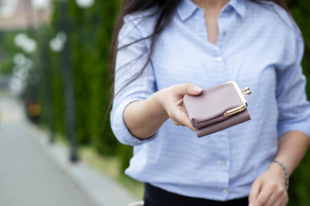 istock woman hand wallet in street 1291655652