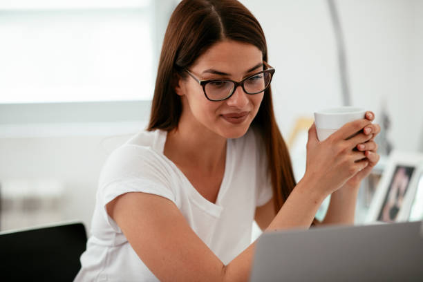 istock Young woman working at home. 1291656655