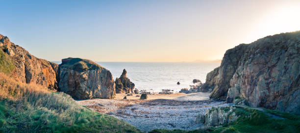 istock Rocky beach on sunny day along the Dublin Bay coastline, in panoramic 1291662300