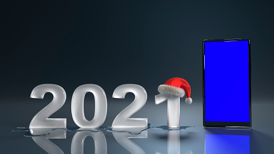 New year concept 2021 Santa hat on icy melted numbers with smartphone
