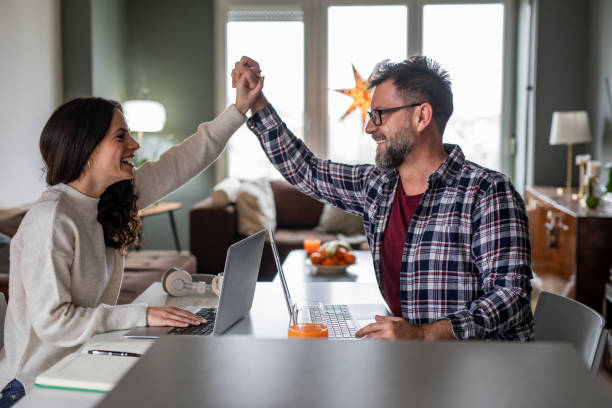 istock Couple working together at home 1291664589