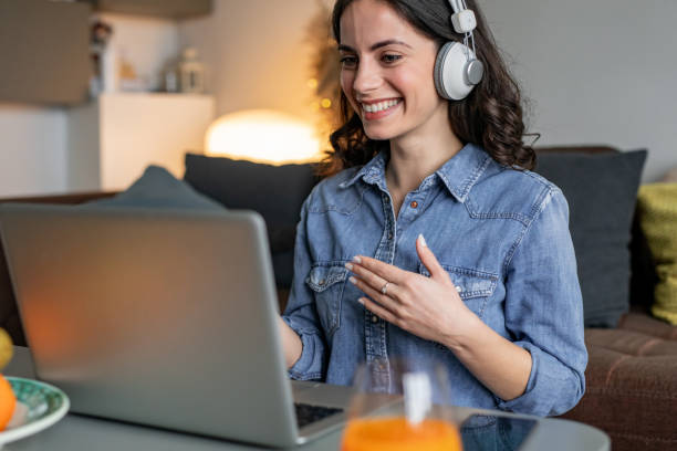 istock Woman using laptop and working from home 1291664834