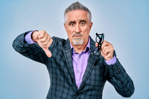 istock Mature handsome businessman in glasses looking at camera 1291673502
