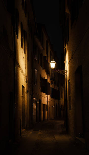 istock Italian town street at night 1291677954