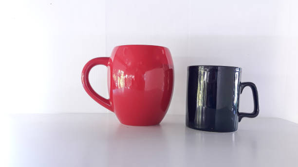 istock Two ceramic cups of different colors, 1291678871