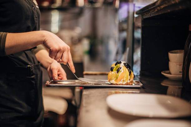 istock Female confectioner working at cafe 1291679138
