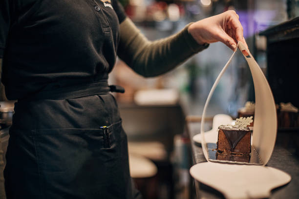 istock Female confectioner working at cafe 1291682470