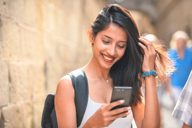 istock Independent Vacationer Checking Smart Phone in Barcelona 1291682524