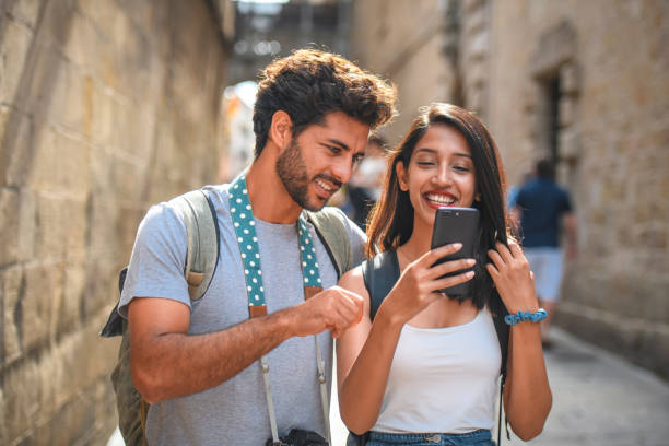 istock Sightseeing Couple Looking at Smart Phone in Gothic Quarter 1291682526