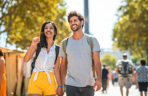 istock Relaxed Young Tourists Walking on The Ramblas in Barcelona 1291682530