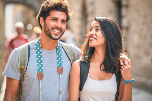 istock Relaxed Tourist Couple Walking Through Gothic Quarter 1291682536