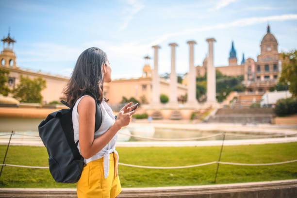 istock Tourist Using Smart Phone for Sightseeing Tips on Montjuic 1291682554