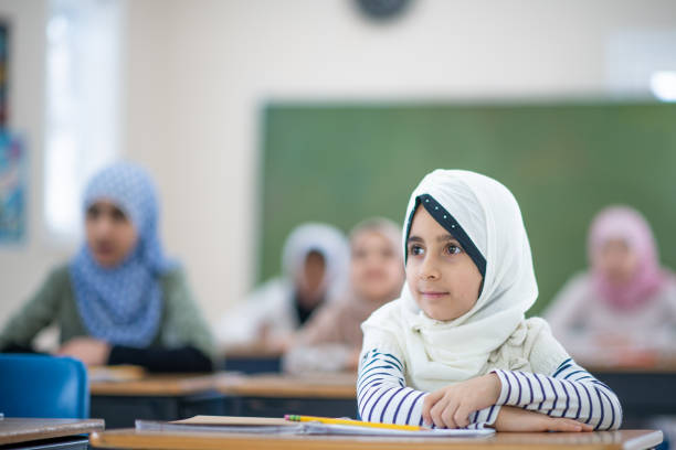 istock Muslim student listening in classroom 1291682604