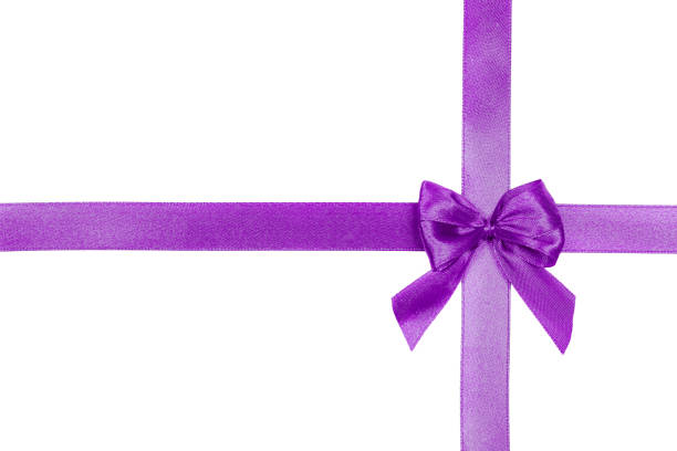 istock Purple satin ribbon with a bow isolated on white background. 1291686160