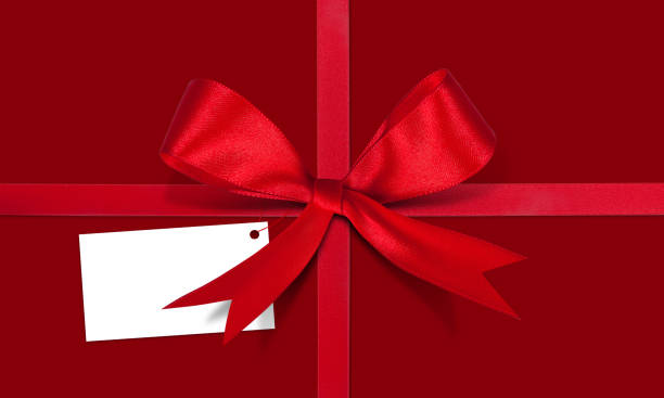 istock Gift card note with ribbon on isolated background 1291687097