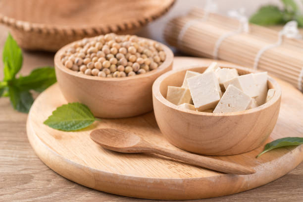 istock Fresh cube tofu and soybean seeds 1291688558