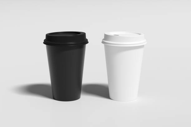 istock Black and white take away coffee paper cups mock up with lids on white background. 1291690106