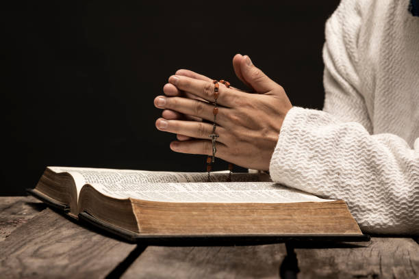istock Jesus Christ Praying and reading the Holy Bible. 1291692425