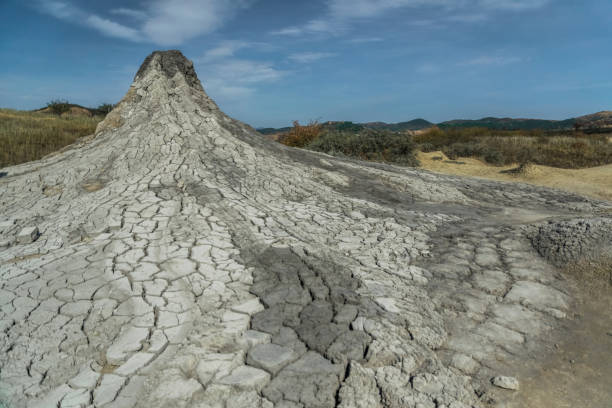 Active mud volcano and cracked soil captured in Romania Active mud volcanoes park captured in Romania baku national park stock pictures, royalty-free photos & images