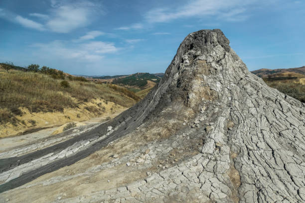 Active mud volcano with cracked soil captured in Romania Active mud volcanoes park captured in Romania baku national park stock pictures, royalty-free photos & images