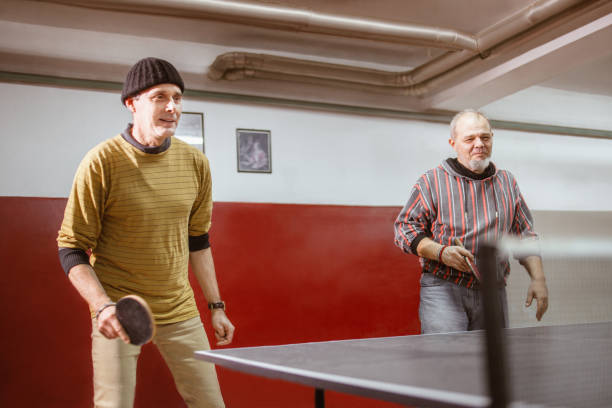 istock Seniors play table tennis recreationally 1291694134