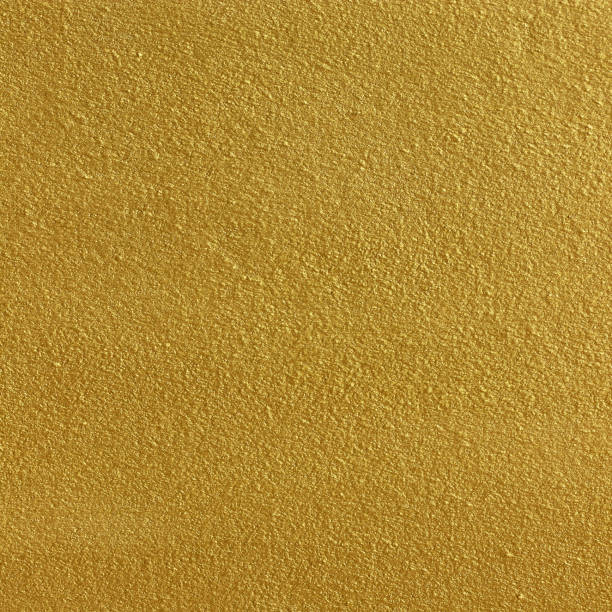 istock Gold paint on cement wall texture or backgrond 1291695052