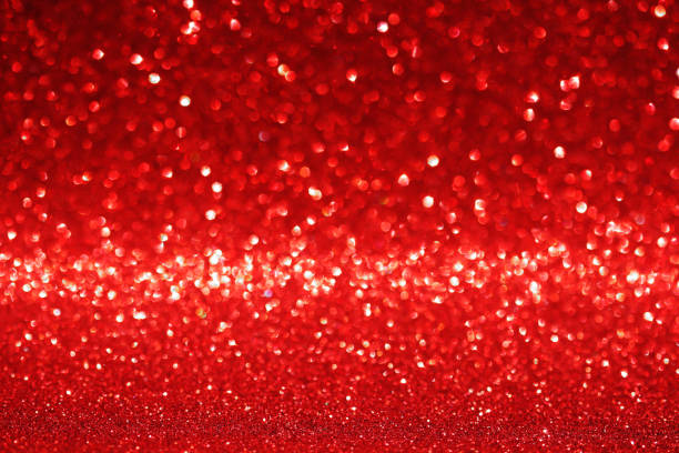 istock Red glitter texture christmas abstract background, Defocused 1291695962