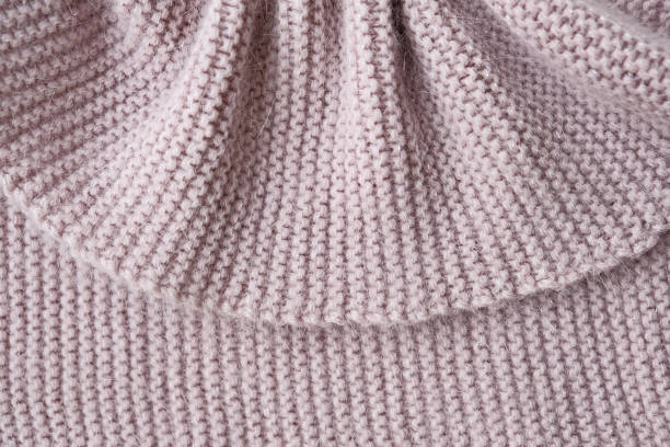 istock Texture of knitted fabric. Stranded threads. Cloth of warm winter clothes 1291697510