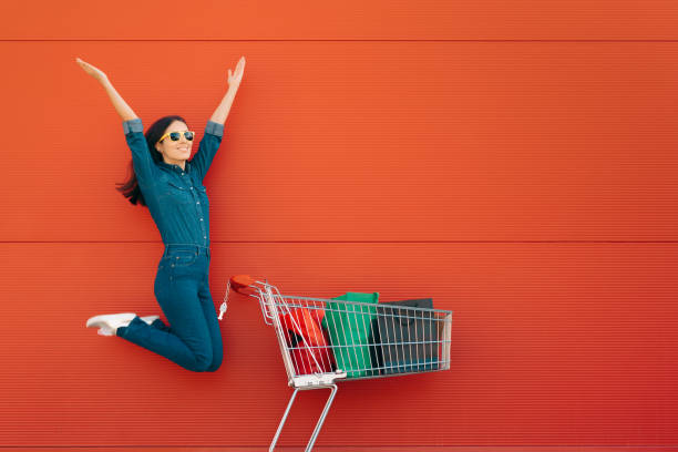 istock Happy Customer Jumping with Joy in front of a Supermarket 1291698297