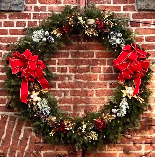 istock Christmas Wreath on Brick Wall. 1291700894
