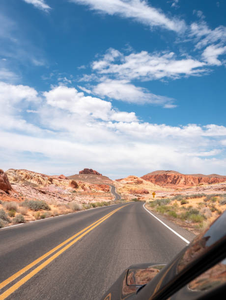 istock Road going through Aztec sandstone formations in Valley of Fire State Park 1291700918