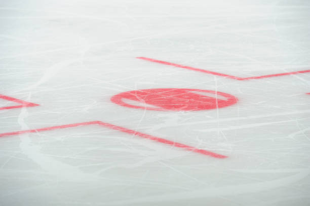 Closeup of face-off circle markings in the ice hockey rink. stock photo