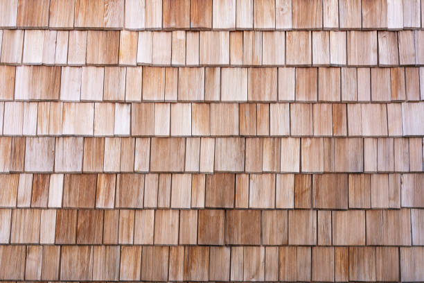 Wooden shingles wall Closeup of a wall covered with wooden shingles wood shingle photos stock pictures, royalty-free photos & images