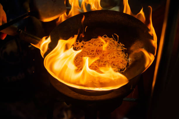 In the evening, Thai-Chinese tourists stroll around and sample street food at Yaowarat Road, Chinatown, Bangkok and sample delicious street food. There are seafood, dessert, pad Thai, noodles