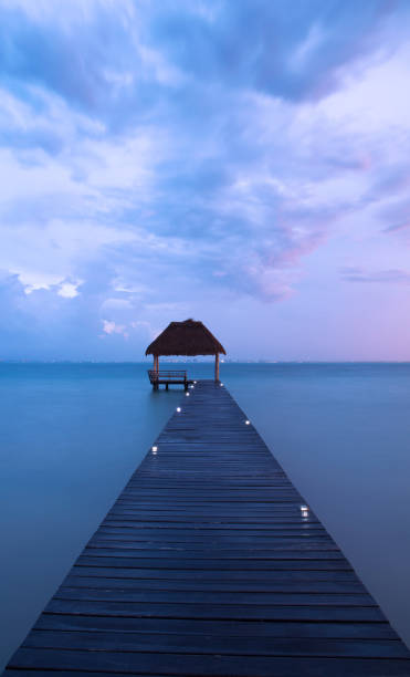 istock Beautiful, tropical ocean dock at Isla, Mujeres, Mexico 1291710217