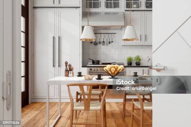 Modern Kitchen Interior With Wooden Chairs Pendant Lights Marble Table And Opened Door Into The Kitchen Stock Photo - Download Image Now