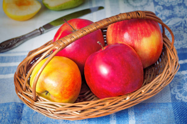 istock Large apples in a wattled basket. 1291720172