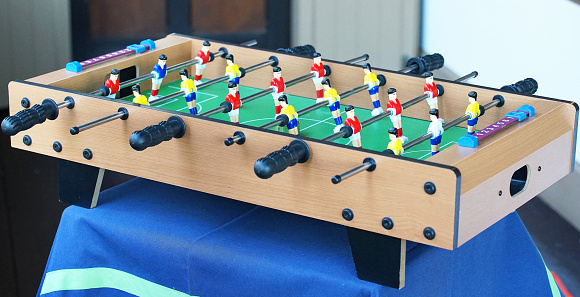 Play of table football of the room