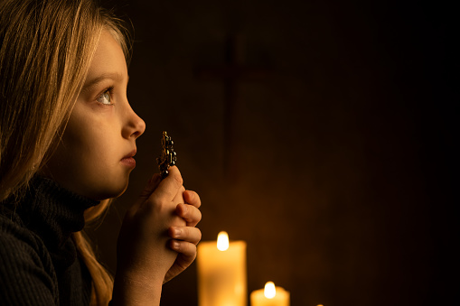 Little girl praying to God