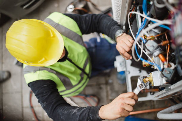 Air conditioner technician services outdoor AC unit and the Gas Generator stock photo