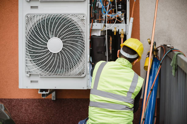 istock Air conditioner technician services outdoor AC unit and the Gas Generator 1291724344