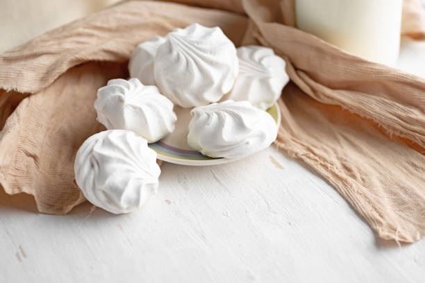 istock White sweet marshmallows in bowl on a wooden table. 1291725578