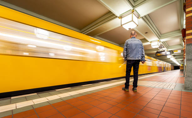 Full Length Of Train At Railroad Station Photo taken in Berlin, Germany standing on subway platform stock pictures, royalty-free photos & images